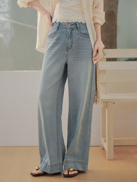 Light wash wide-leg jeans worn by a model