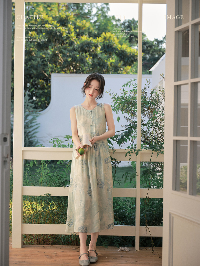 Sleeveless floral midi dress worn by a model outdoors