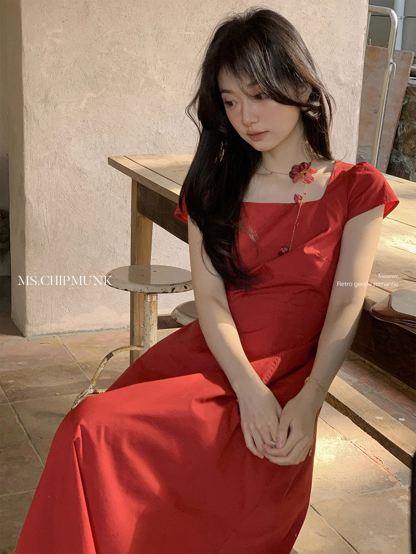 Red short-sleeve dress worn by a model