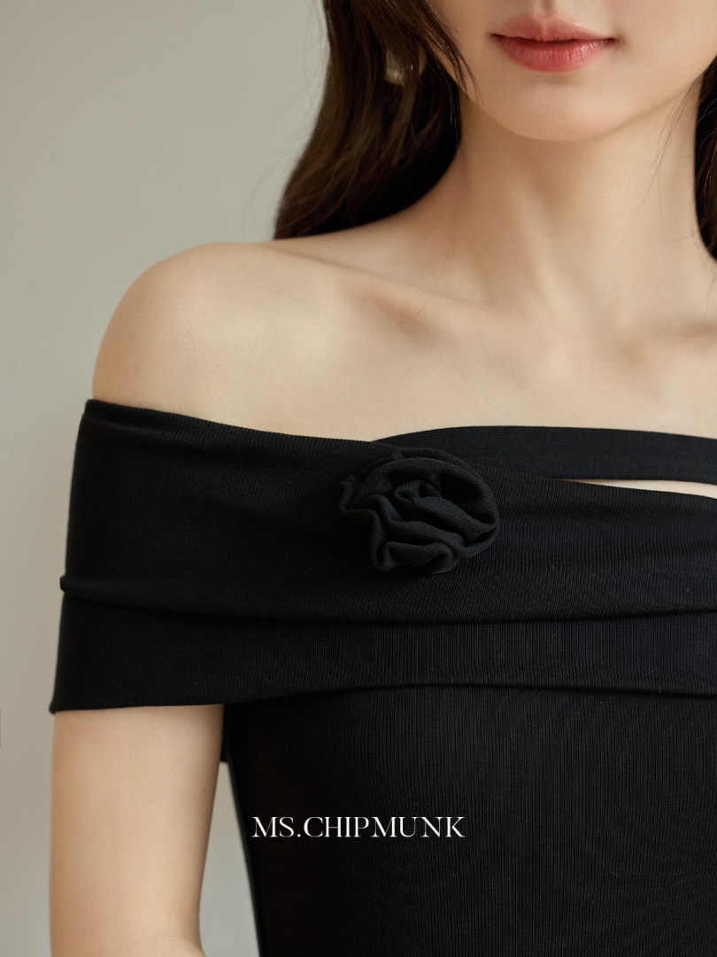 Black off-shoulder ribbed dress worn by a model