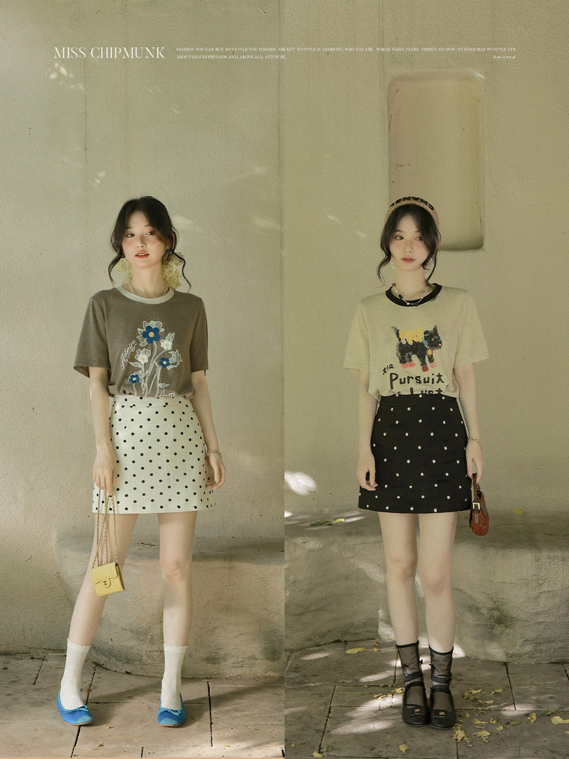 Two women wearing graphic T-shirts and polka dot mini skirts in a fashion lookbook photo