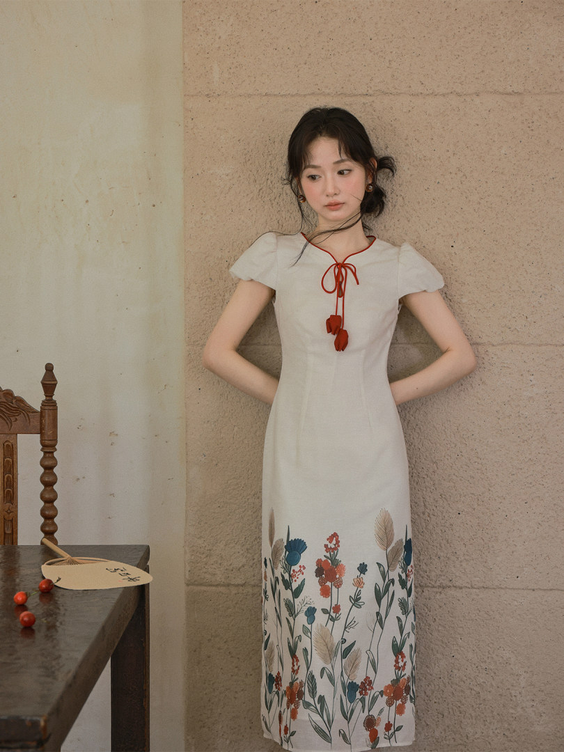 White floral midi dress worn by a model