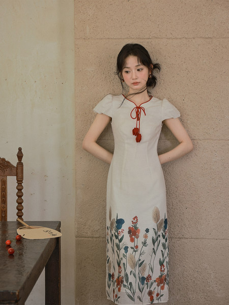 White floral midi dress worn by a model