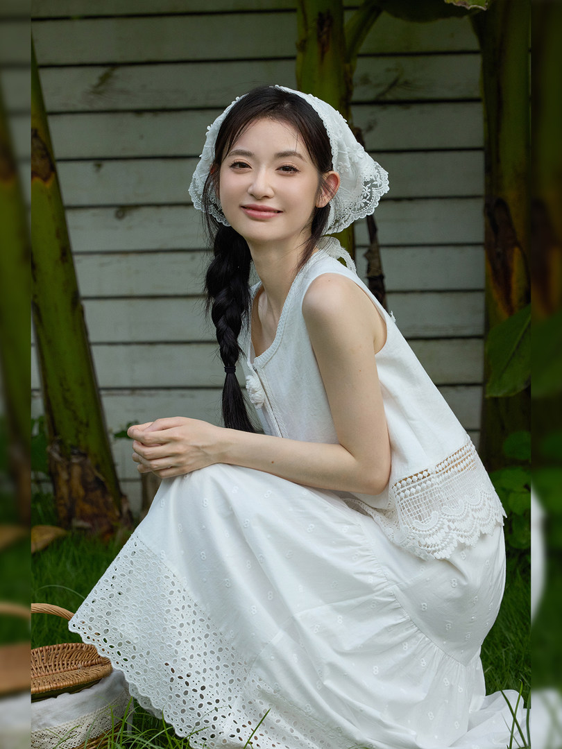 White lace dress worn by a model outdoors