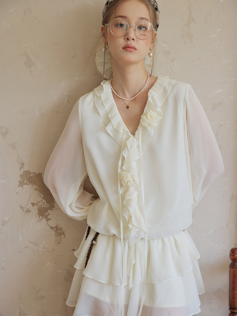 White ruffled dress worn by a model