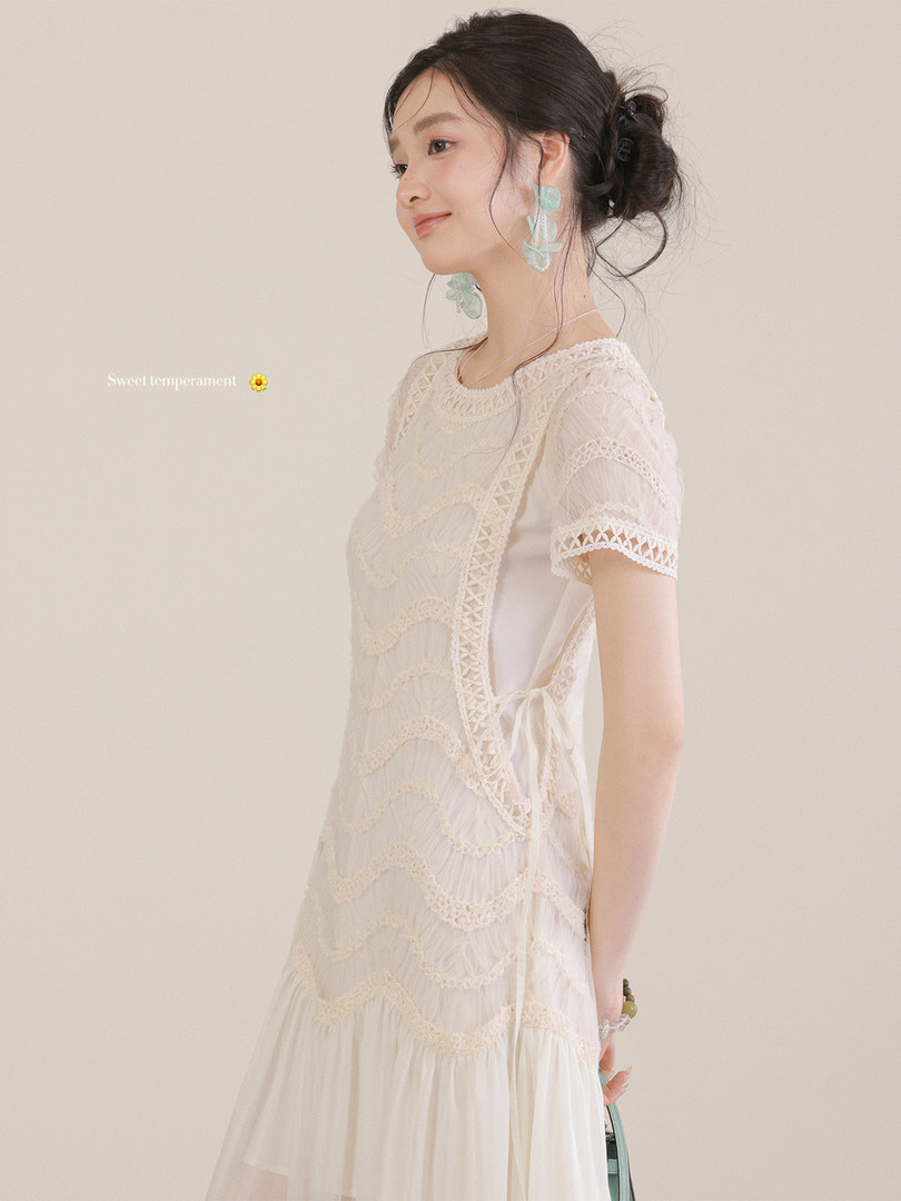 Model wearing a cream lace short-sleeve dress