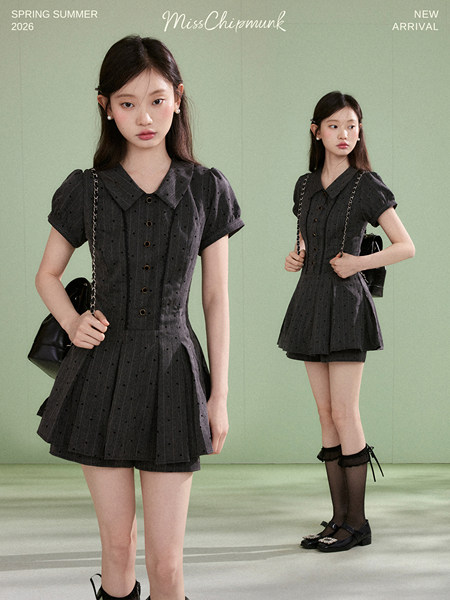 Black short-sleeve button-front mini dress worn by a model