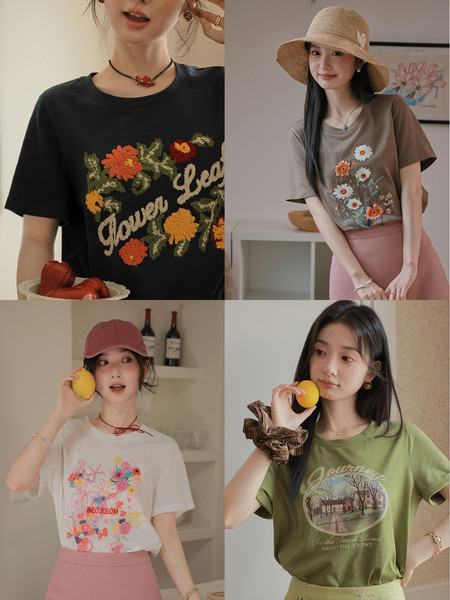 Four women modeling floral graphic t-shirts in different colors