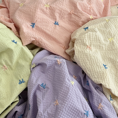 布亦 夏季清新糖果色涤纶面料小细格纹刺绣蝴蝶结连衣裙服装布料