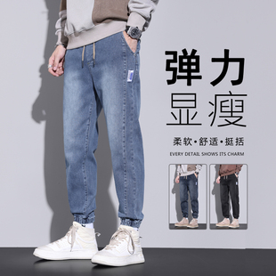 男生工装加绒牛仔裤冬加厚2026新款宽松松紧腰束脚哈伦弹力男裤子