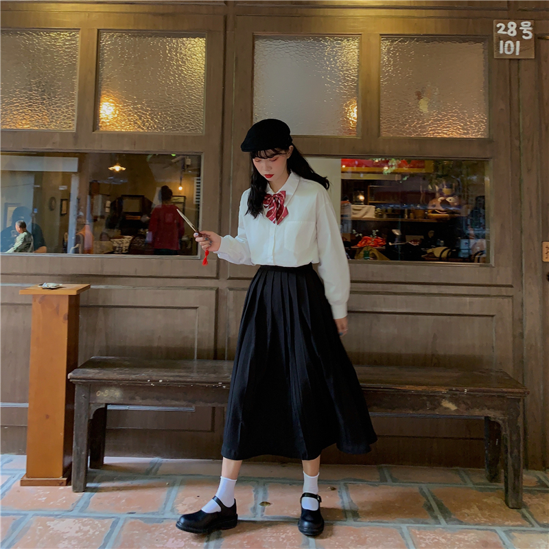 Big goods have come out of College style white long sleeve shirt with bow tie and black thin pleated skirt