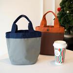 简约纯色圆筒形手提饭盒袋大容量防水皮磨料小包通勤百搭便当包