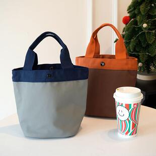 简约纯色圆筒形手提饭盒袋大容量防水皮磨料小包通勤百搭便当包