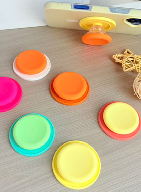 橙色硅胶磁吸气囊手机支架桌面追剧防摔伸缩旋转拆卸DIY吸盘支架