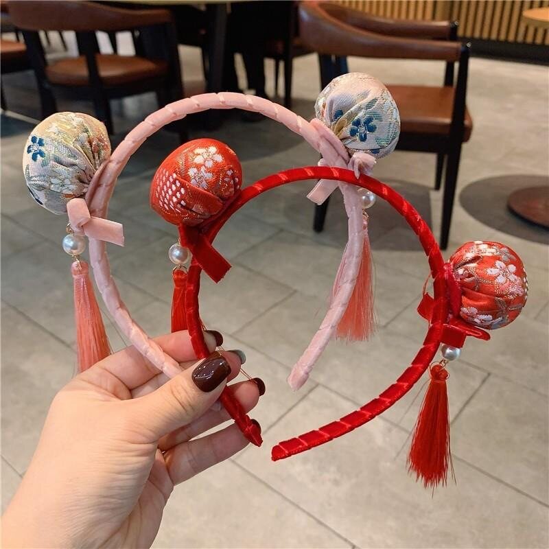 女童新中式红色发箍布艺圆球流苏图片