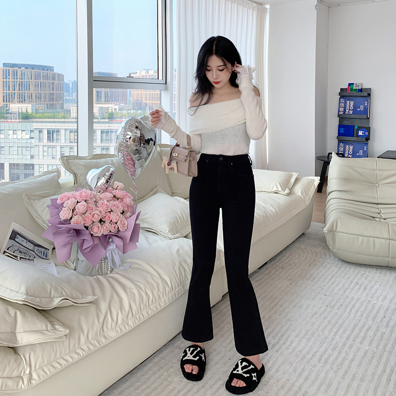 西草儿黑色九分微喇四面弹牛仔裤