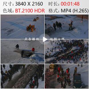 航拍黑龙江大庆市连环湖冬捕冬天凿冰下网捕鱼高清实拍视频素材