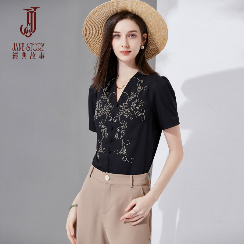 法式别致白色衬衣女2025年春新款时尚知性短袖设计泡泡袖v领衬衫