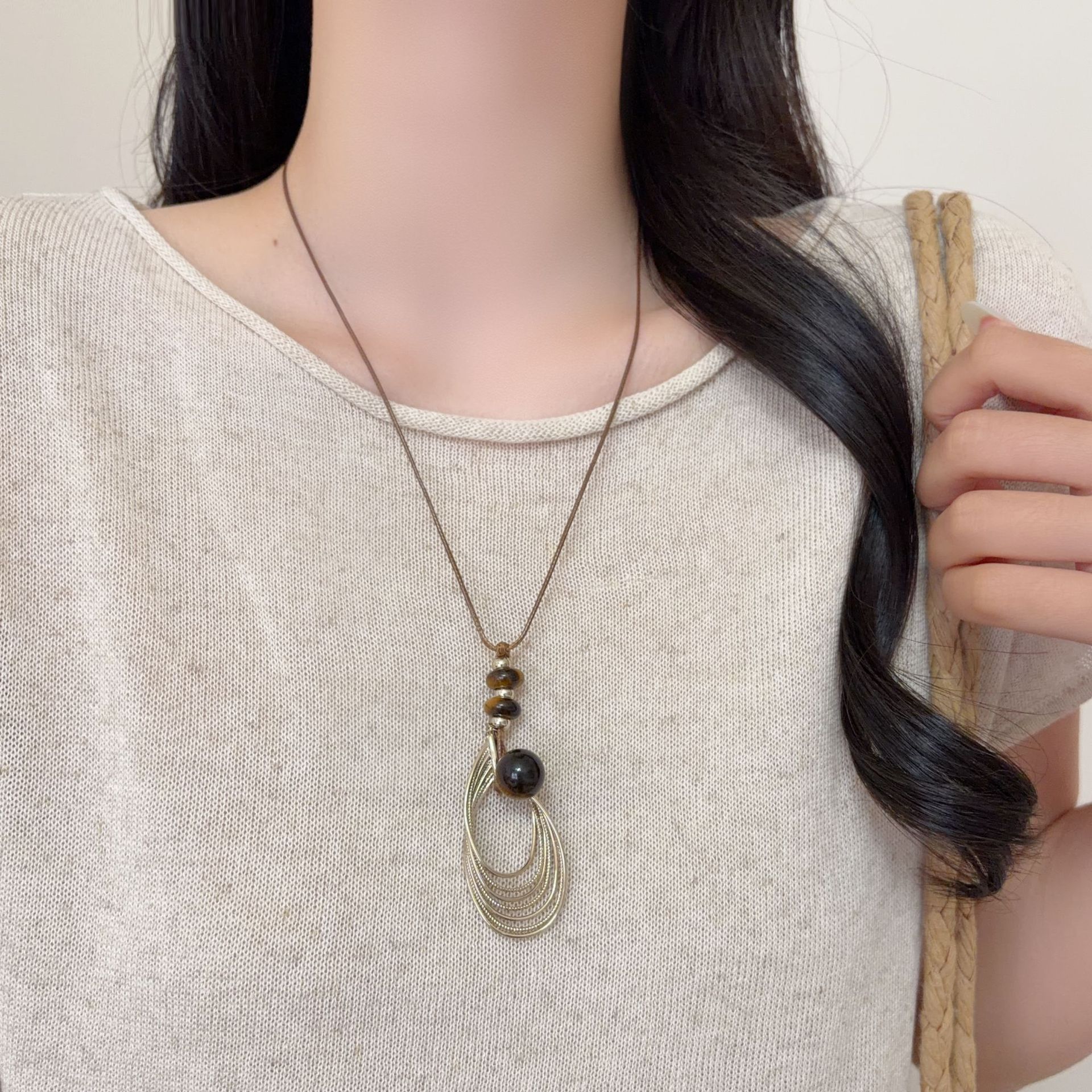 秋冬高级感复古美拉德咖啡金雀羽虎眼石项链女小众设计毛衣链配饰