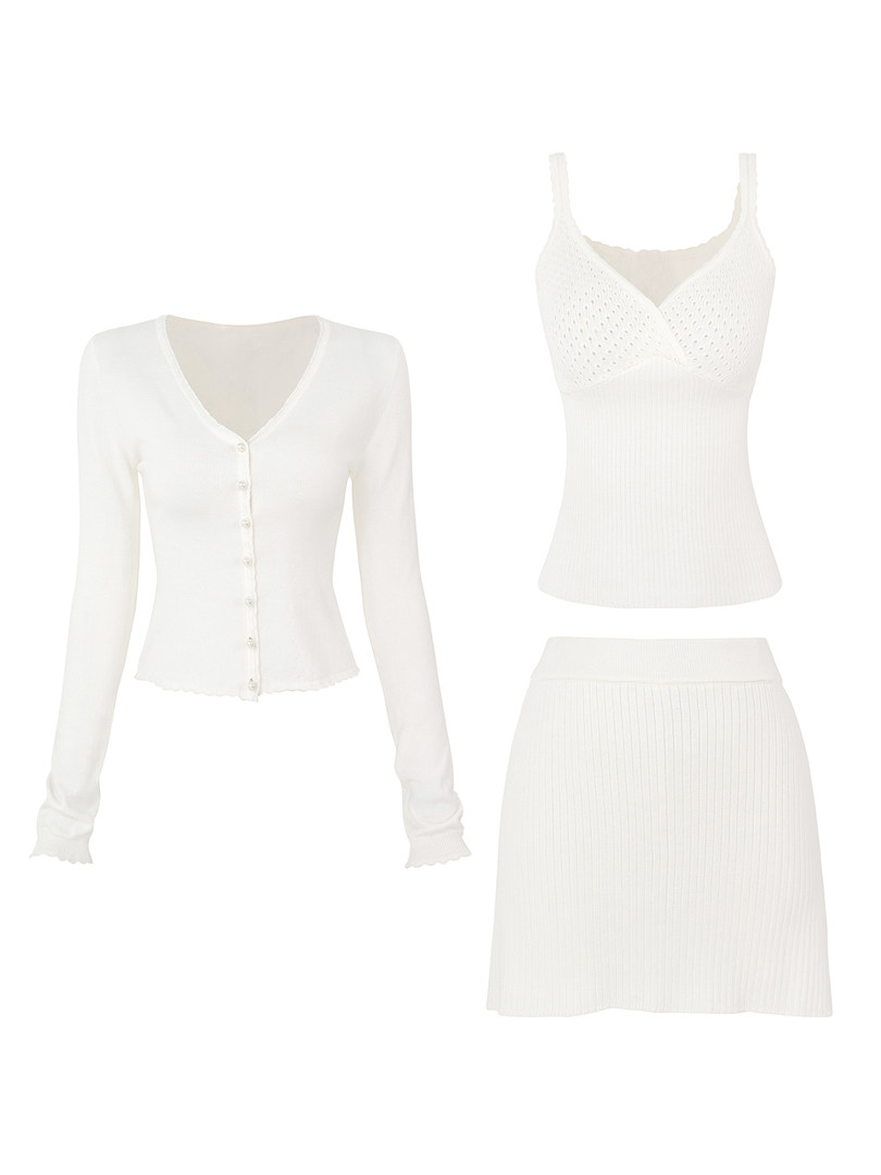 White knit cardigan, camisole, and skirt set displayed flat