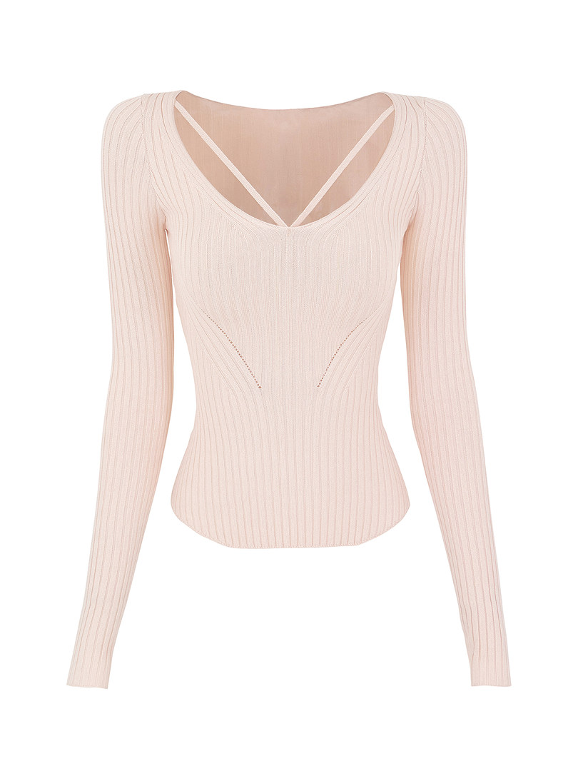 Light pink ribbed long-sleeve top with crisscross back detail on white background