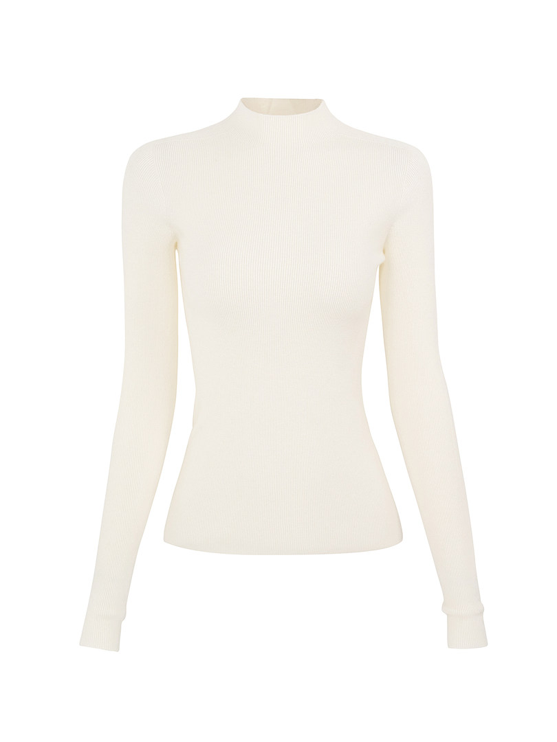Cream ribbed long-sleeve turtleneck sweater on white background