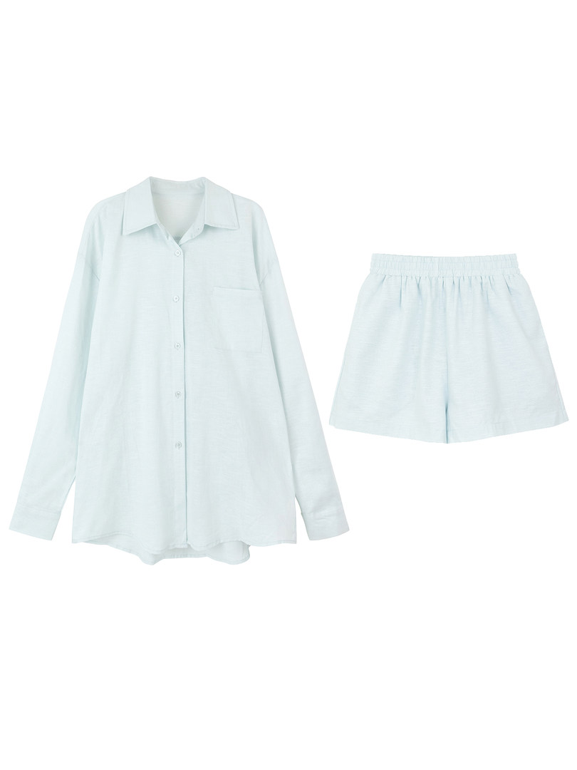 Light blue button-up shirt and matching shorts set on white background