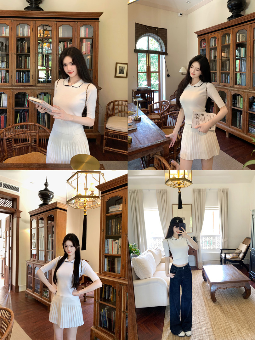 Model wearing a white ribbed dress and a white top with jeans in a library setting