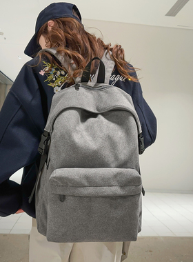 鹿皮绒双肩包女大学生简约百搭轻便高中男大容量休闲背包灰色书包