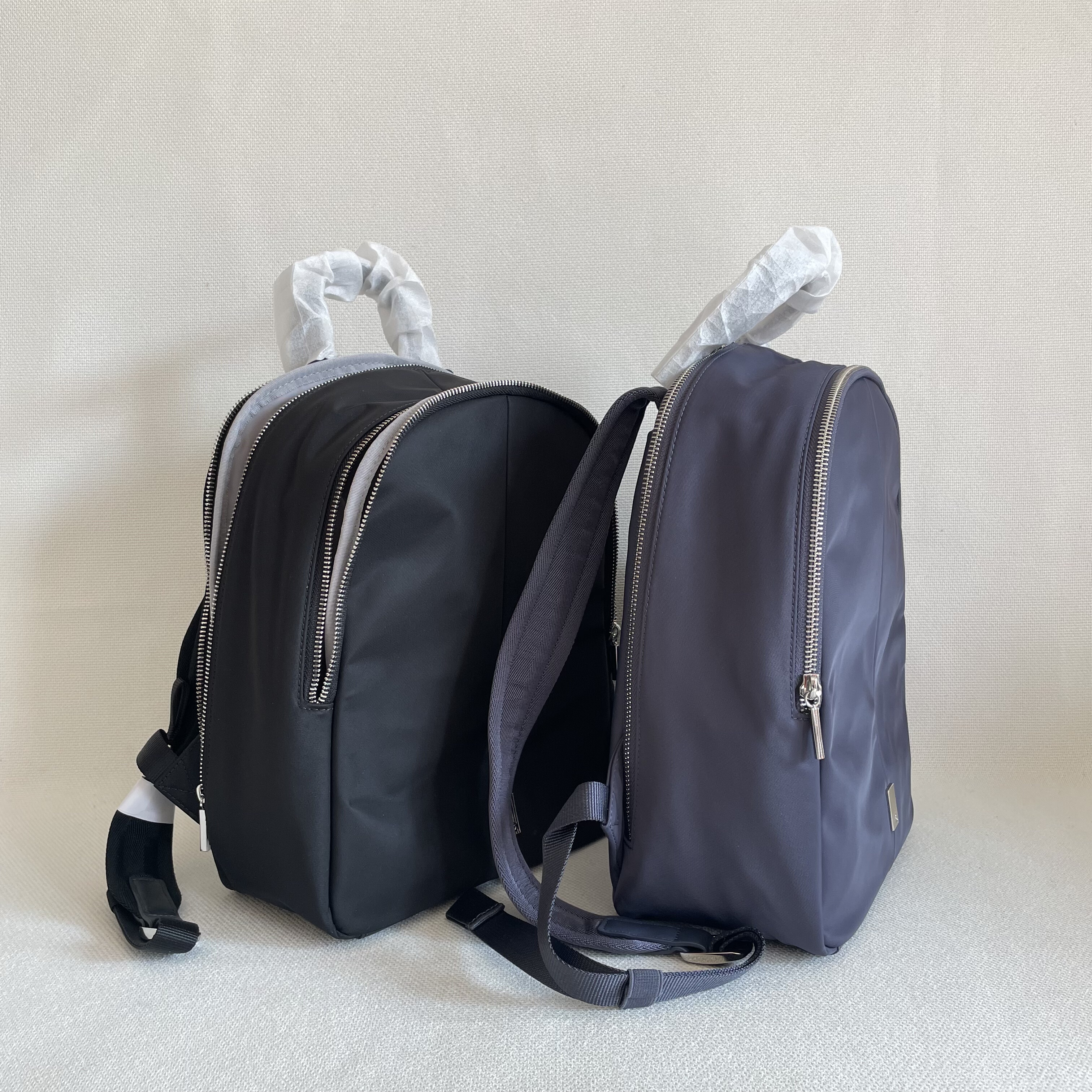 外贸原单尾货 时尚轻便黑色深紫青色尼龙双肩背包日常上班通勤包