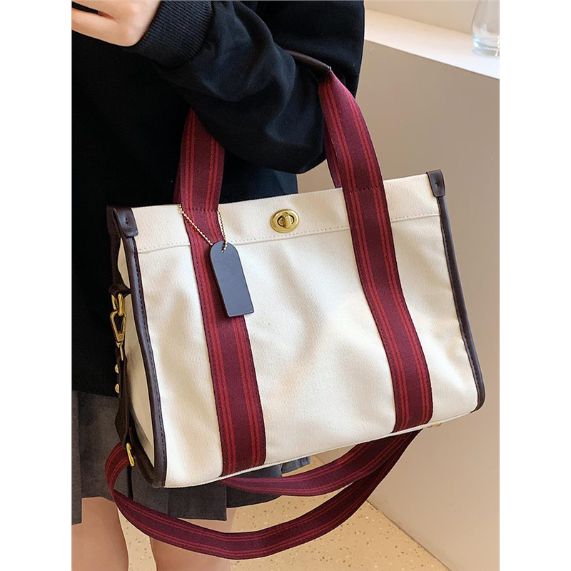 红色帆布包女士2026新款大容量大学生上班通勤撞色手提单肩斜挎包
