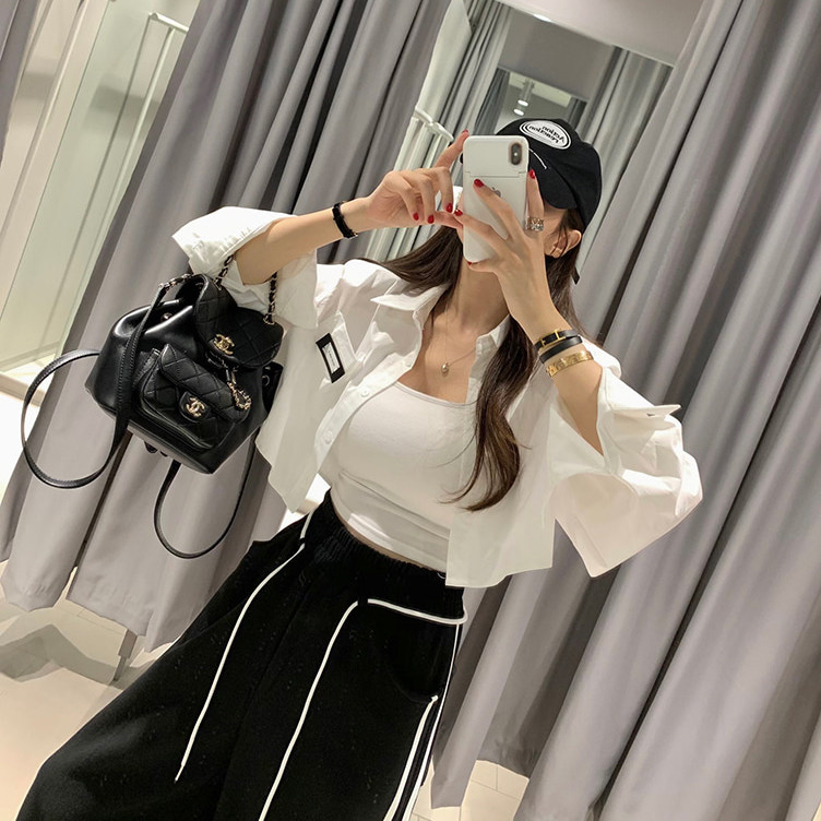 韩国东大门2025春装新款减龄纯色高腰翻领个性贴标短款长袖衬衫女