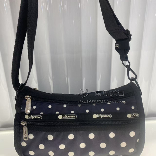 H020-N183时尚单肩斜挎包24*14*14cm黑底波点