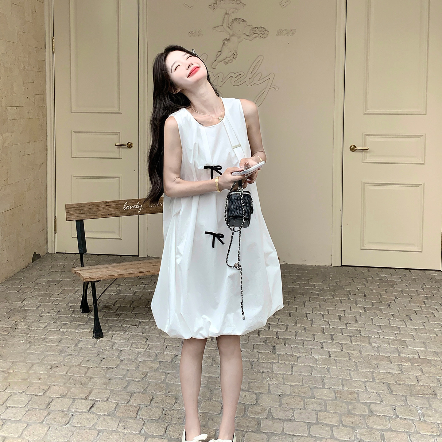 夏季度假风无袖蝴蝶结花苞连衣裙