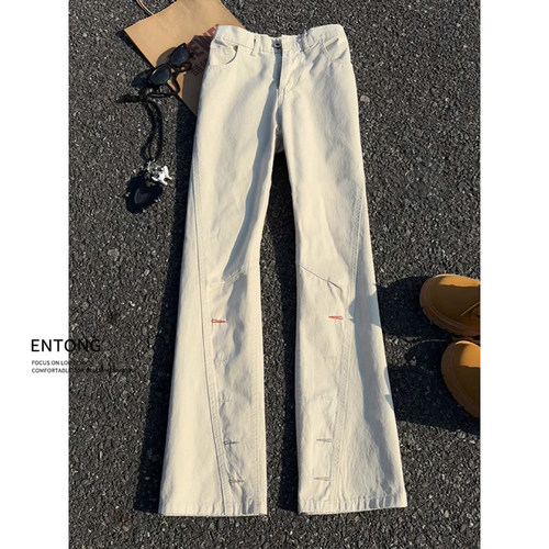 纽扣孔刺绣斜切牛仔裤子