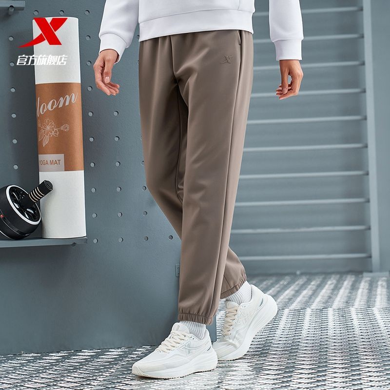 特步梭织女运动裤防风防泼水保暖