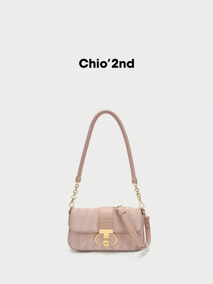 Pink quilted shoulder handbag with gold hardware on a white background