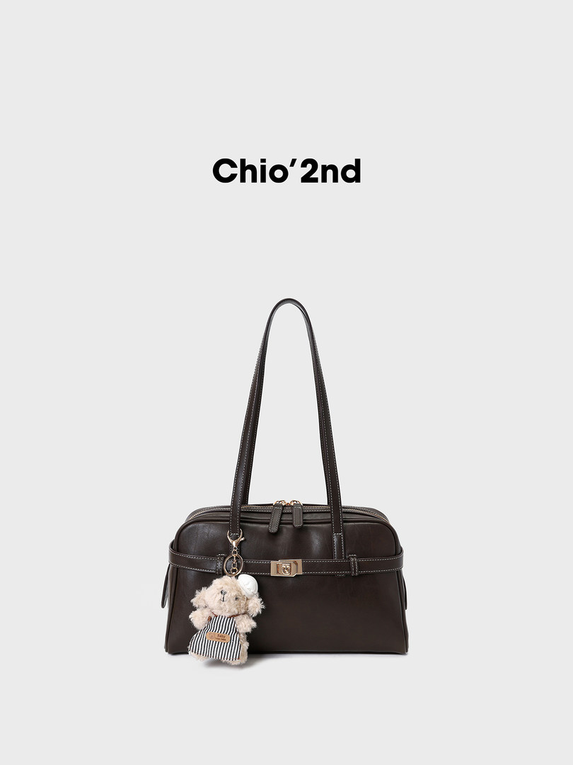 Black leather handbag with long shoulder straps and teddy charm