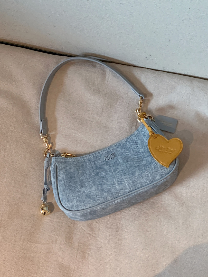 Light blue mini shoulder bag with gold hardware and heart charm
