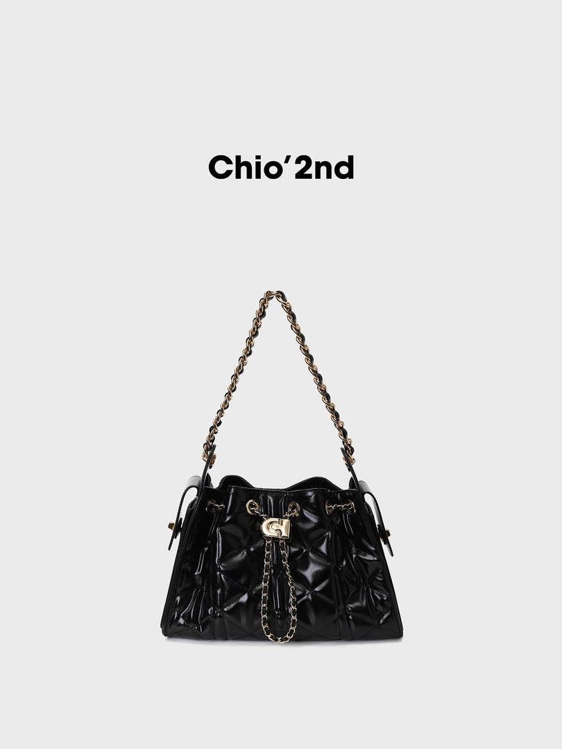 Black quilted chain-strap handbag on a plain background