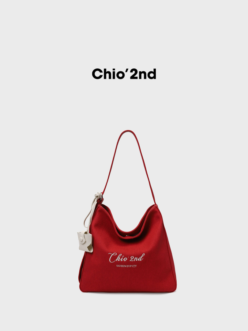 Red shoulder bag with brand text on white background