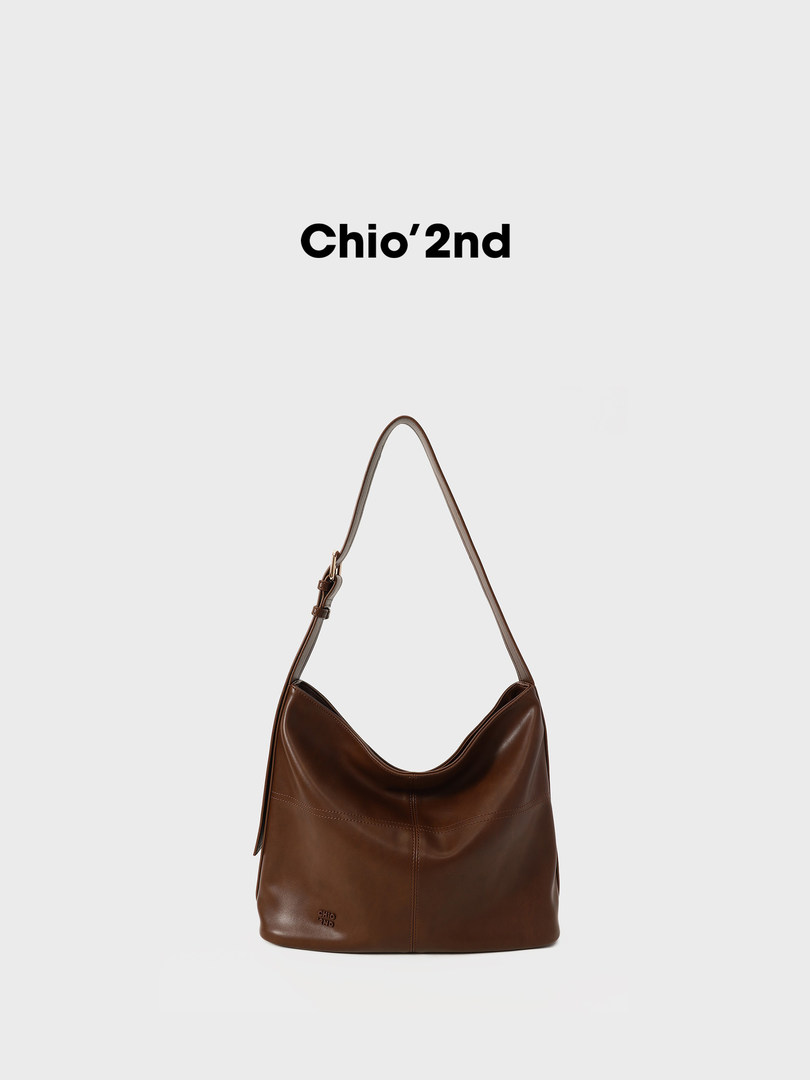 Brown leather shoulder bag on a white background