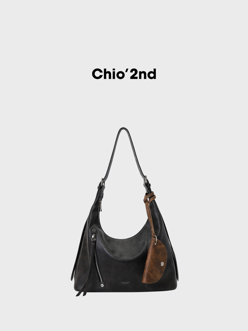 Black leather shoulder bag with brown leather accent and zipper detail