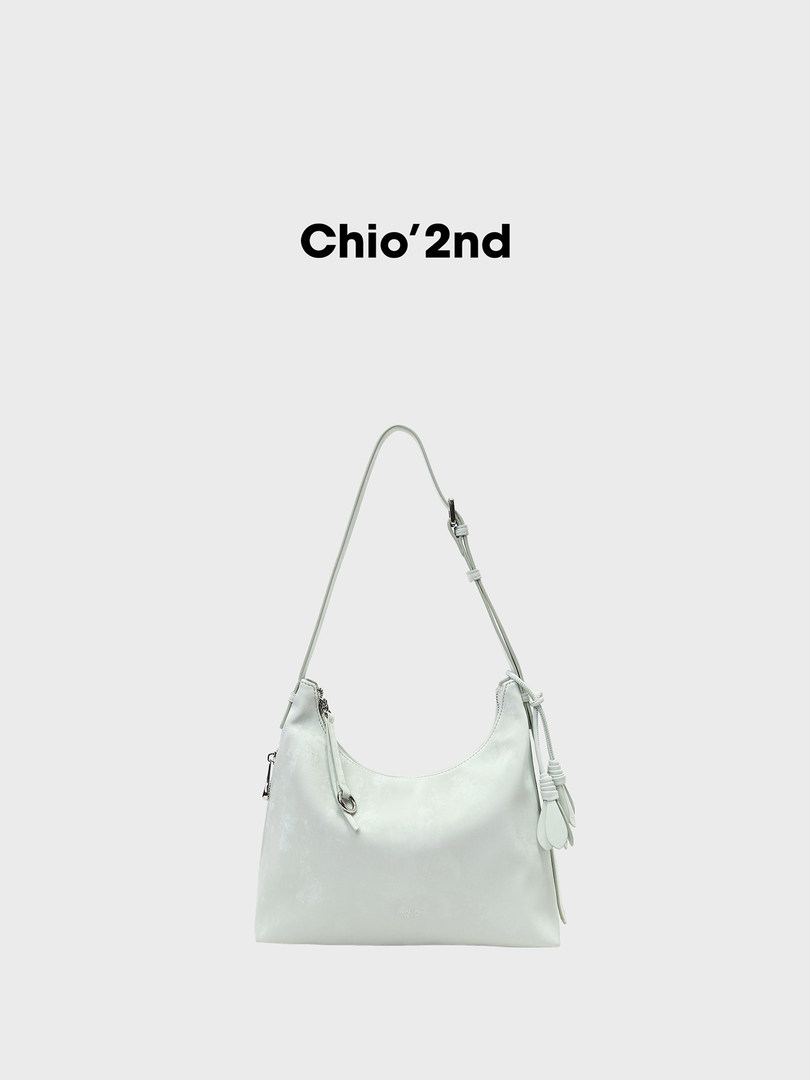 Light mint shoulder handbag on a plain background