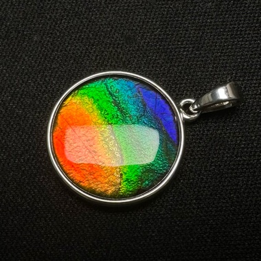 天然加拿大斑彩石15mm水晶面七彩平面圆形吊坠