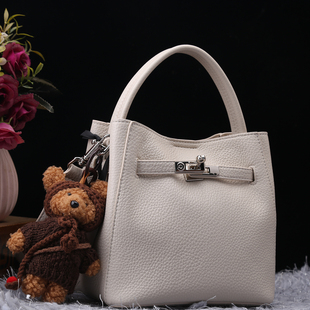 康泰娜专柜正品真皮女包2025新款时尚头层皮荔枝纹菜篮子包水桶包