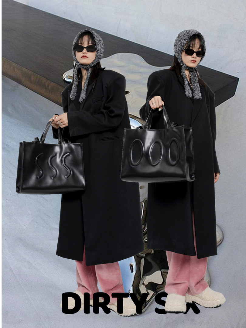 Black leather tote bags held by models in oversized black coats
