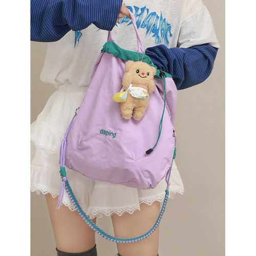 尼龙防水轻便斜跨包多巴胺束口包