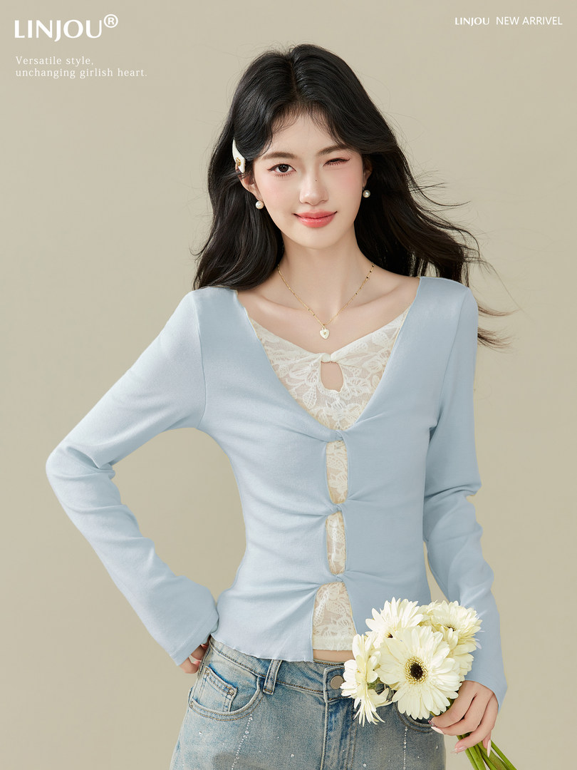 Light blue long-sleeve lace-trim blouse worn by a model