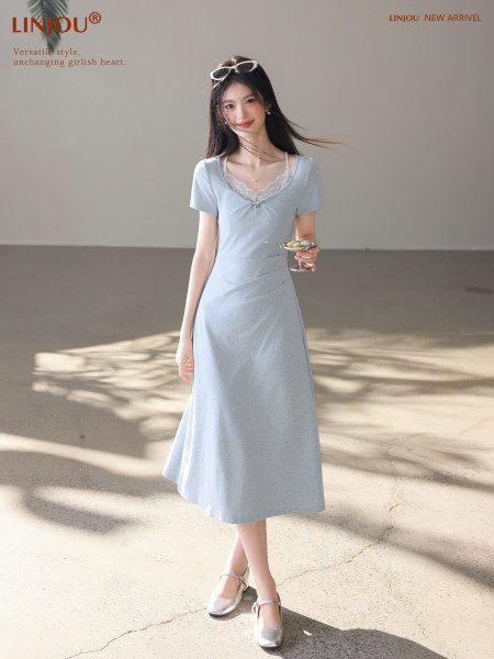 Model wearing a light blue short-sleeve midi dress with lace neckline detail